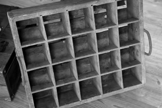 A traditional box for beer bottles or effervescent bottles made of wood. Very old!