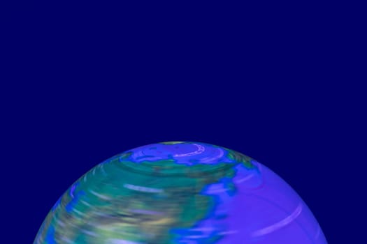 Background Earth shining. A luminous and rotating terrestrial globe or planet earth against dark background with space for design. Beautiful backdrop. Macro.