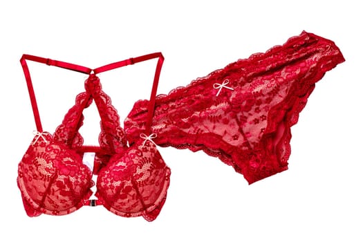 Bra and panties isolated. Close-up of a beautiful feminine stylish red bra and a luxurious elegant sexy red lace thong panties isolated on a white background. Underwear fashion.