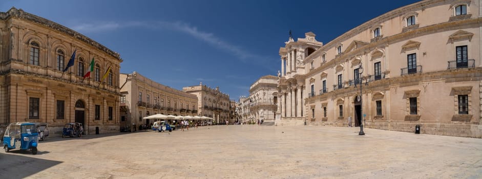 Syracuse, Italy - 08 18 2020: The white cathedral square in Ortigia island in Syracuse, Italy.