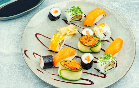 Appetizing colorful sushi rolls on the plate. Sushi menu. Japanese food.