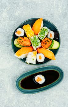 Appetizing colorful sushi rolls on the plate. Sushi menu. Japanese food.