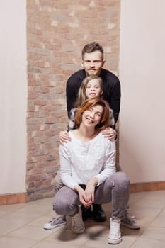Portrait of happy family hugging each other