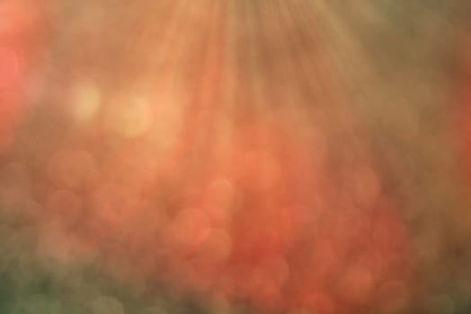 Pastel colored bokeh background with defocused round lights and sunbeams, flare overlay