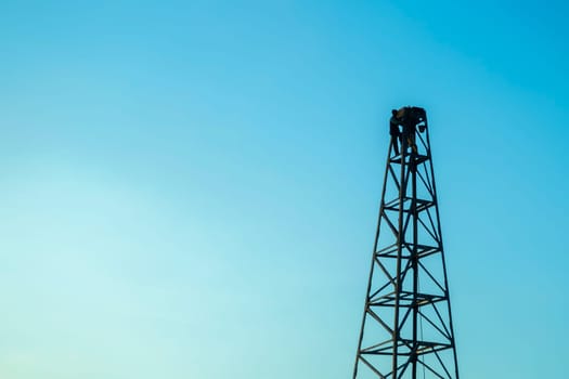 Pile rig construction worker building in evening