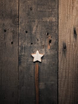 Cinnamon star cookie on a wooden background, Christmas bakery or seasonal pastry