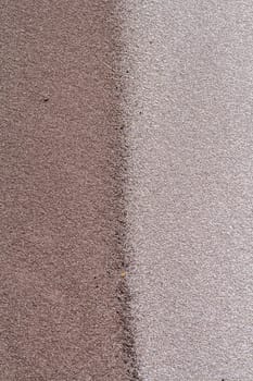 Sands mixing cream,grey,brown,colors joining line on beach embankment background.