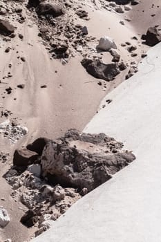 Sands mixing cream,grey,brown,colors joining line on beach embankment background.