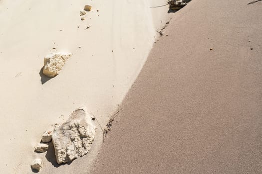 Sands mixing cream,grey,brown,colors joining line on beach embankment background.