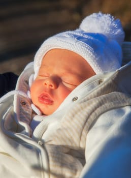 Baby boy of 3 weeks old taken out for fresh air in the woods.
