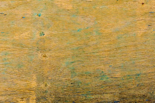 Weathered yellow wood with peeling paint