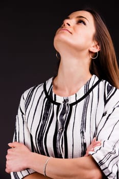 A long-haired beautiful self-confident woman posing