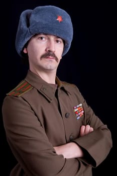 young man dressed as russian military, studio