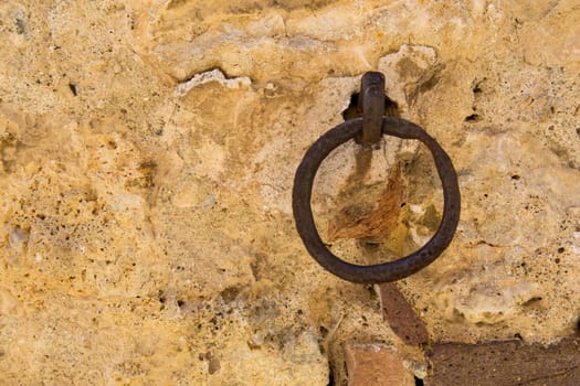 Close-up of an antique ring for tying horses