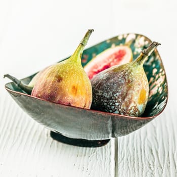 Bowl of sweet ripe succulent figs for a healthy snack or to use as a cooking ingredient, a natural laxative and rich in vitamins