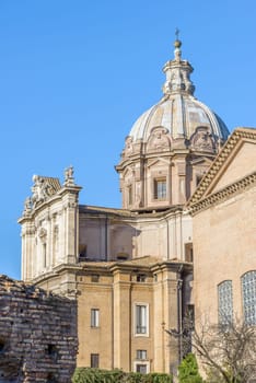 Ruins buildings and statue in the foro romano in Rome italy
