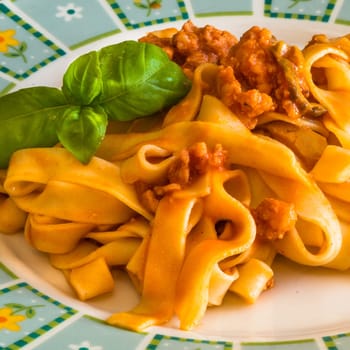 Fettuccine or tagliatelle cooked with sauce bolognese ready to eat