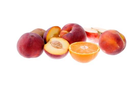 some peaches and a orange isolated on white background