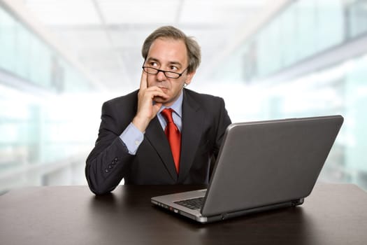 mature business man working with his laptop