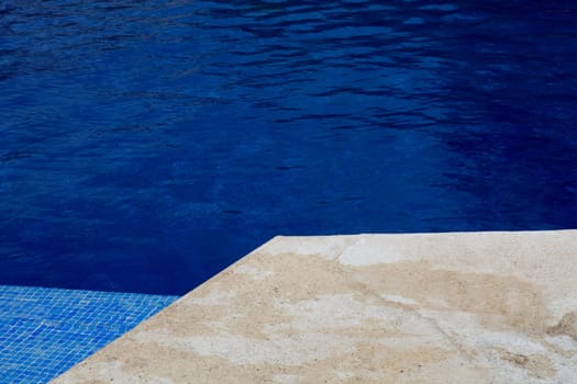 swimming pool blue water detail in summer time