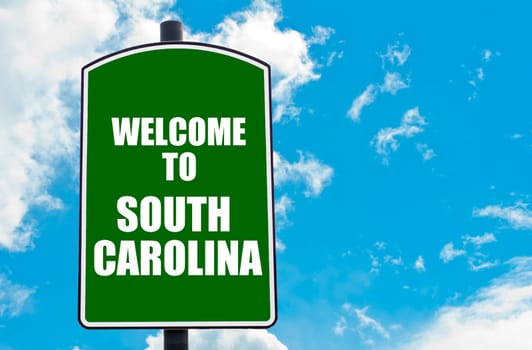 Green road sign with greeting message WELCOME TO ORLANDO isolated over clear blue sky background with available copy space. Travel destination concept  image