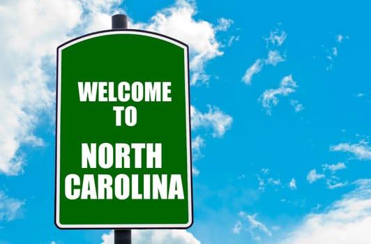 Green road sign with greeting message WELCOME TO ORLANDO isolated over clear blue sky background with available copy space. Travel destination concept  image