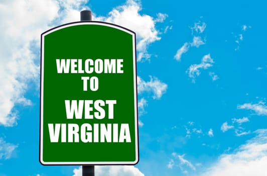 Green road sign with greeting message WELCOME TO ORLANDO isolated over clear blue sky background with available copy space. Travel destination concept  image