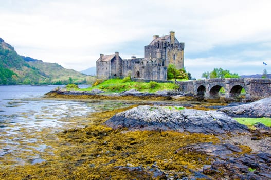 Famous Eilean Donan Castle in Scotland, UK. Situated on a small isle at the meeting point of three sea lochs - Loch Long, Loch Duich and Loch Alsh, is one of the most iconic images of Scotland.