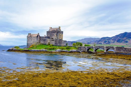 Famous Eilean Donan Castle in Scotland, UK. Situated on a small isle at the meeting point of three sea lochs - Loch Long, Loch Duich and Loch Alsh, is one of the most iconic images of Scotland.