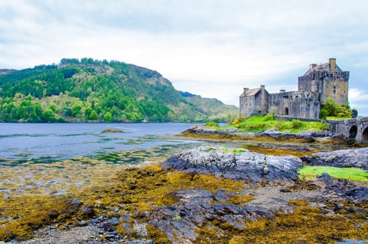 Famous Eilean Donan Castle in Scotland, UK. Situated on a small isle at the meeting point of three sea lochs - Loch Long, Loch Duich and Loch Alsh, is one of the most iconic images of Scotland.