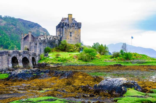 Famous Eilean Donan Castle in Scotland, UK. Situated on a small isle at the meeting point of three sea lochs - Loch Long, Loch Duich and Loch Alsh, is one of the most iconic images of Scotland.
