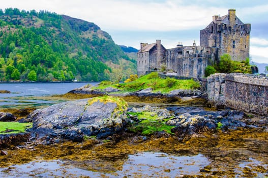 Famous Eilean Donan Castle in Scotland, UK. Situated on a small isle at the meeting point of three sea lochs - Loch Long, Loch Duich and Loch Alsh, is one of the most iconic images of Scotland.