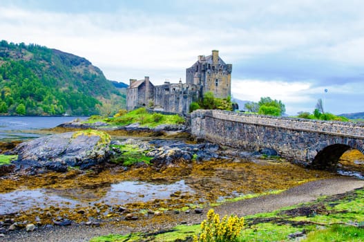 Famous Eilean Donan Castle in Scotland, UK. Situated on a small isle at the meeting point of three sea lochs - Loch Long, Loch Duich and Loch Alsh, is one of the most iconic images of Scotland.