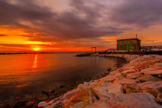 View of the sunset in Marina di Massa using the technique hdr