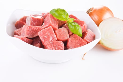 Diced beef with onion over white background