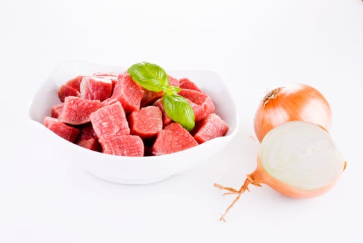 Diced beef with onion over white background