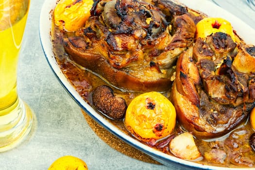 Roasted knuckle of pork with cabbage and beer. Traditional German recipe.