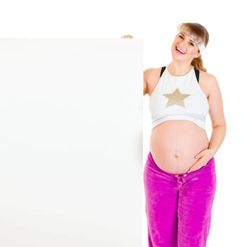 Happy beautiful pregnant woman holding blank billboard  isolated on white.