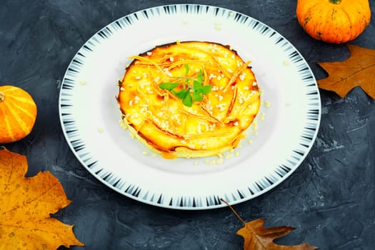 Baked casserole with pumpkin and cottage cheese. Autumn baking with pumpkin.