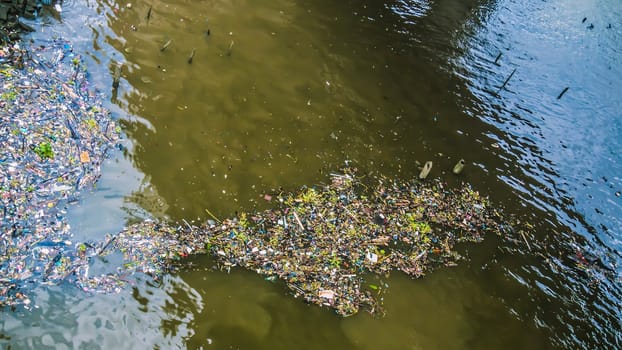 water garbage Polluted water Fishes dirty river with trash and plastic Freshwater pollution