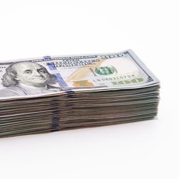 A large stack of hundred-dollar cash bills on a white background. Isolated. Layout, mockup, place for lettering and logo.