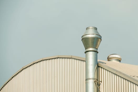 Several white ventilation vents are located near building.