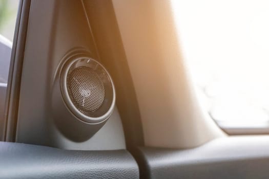 Black car speaker mounted inside the car