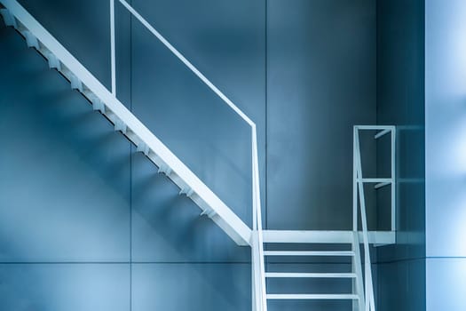 White iron staircase next to the building