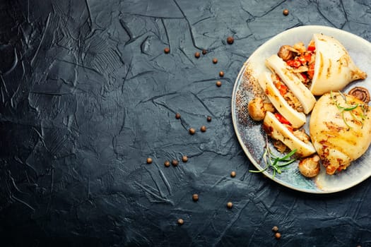 Grilled squids with vegetable stuffing. Stuffed calamari in grill pan