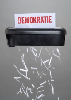 A shredder destroying a document - Democracy in german - Demokratie
