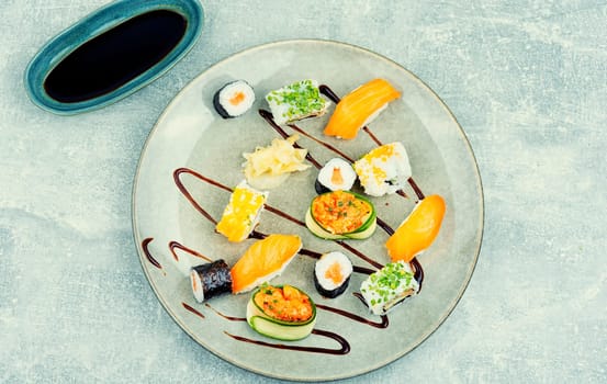 Appetizing sushi rolls on the plate. Sushi menu.