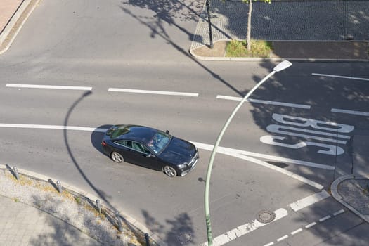 Street scene with cars at Kurfuerstendamm in Berlin from bird's eye view