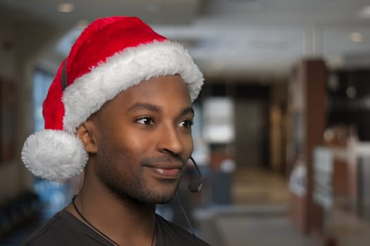 holiday support center christmas helpline customer service assistant wearing santa claus red hat and headset microphone