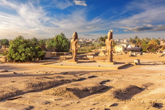 The great Colossal statues near Mortuary Temple of Thutmose III, Luxor, Egypt.